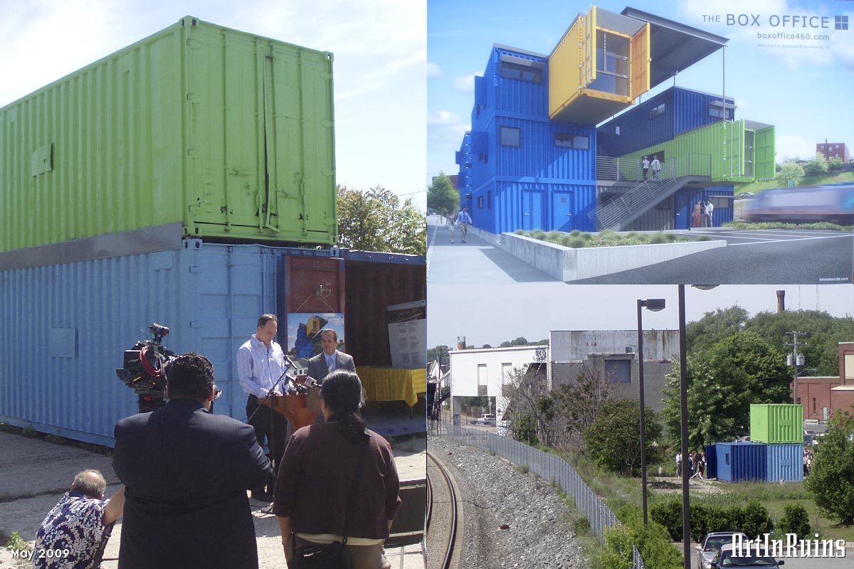 An admittedly odd-looking structure consisting of Lego-like shipping containers stacked on top of one another and cantilevering out into mid air, brightly painted, with small cut-out windows and an interior breezeway under a steel canopy.
