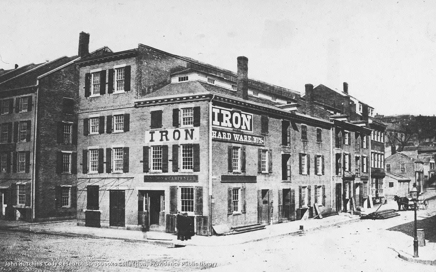 A block of three onjoined three- and four-story red brick buildings with granite window sills. The earliest building dates from 1793 and the latest from 1847. The oldest building is a four-story rectangular block with a flat roof; to the south is another older three-story building with a hipped monitor roof; in the middle is a three and a half story building with a clerstory monitor roof; and on the east end is a four-and-a-half story building with another clerstory monitor roof.
