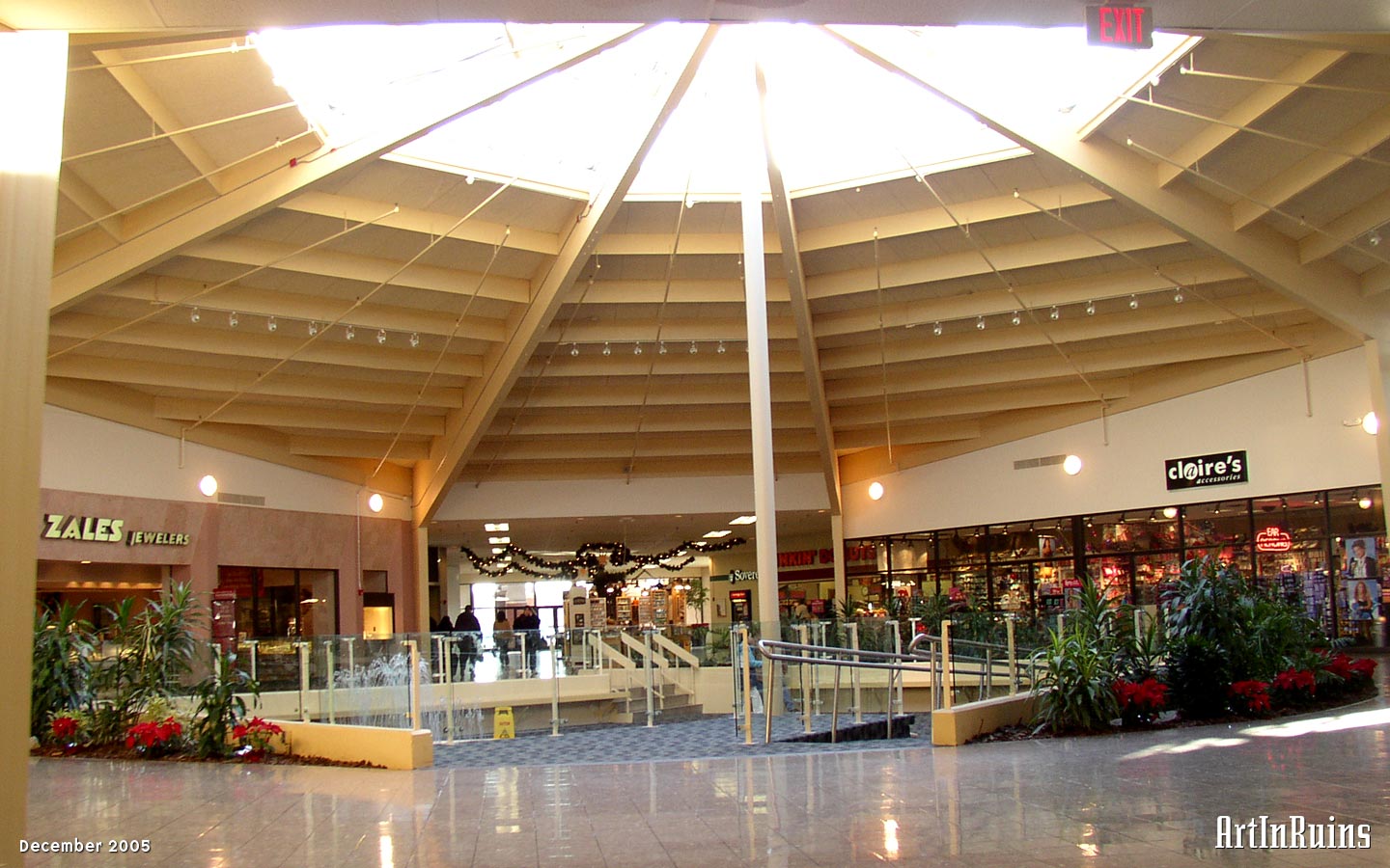 A fairly typical 1970s mall in the suburban town of Lincoln, RI. Originally built as two wings with an anchor on each end centered around a rotunda-style atrium, the wings have been shortened dramatically as retail anchors have turned their back to the mall and faced the parking lots.